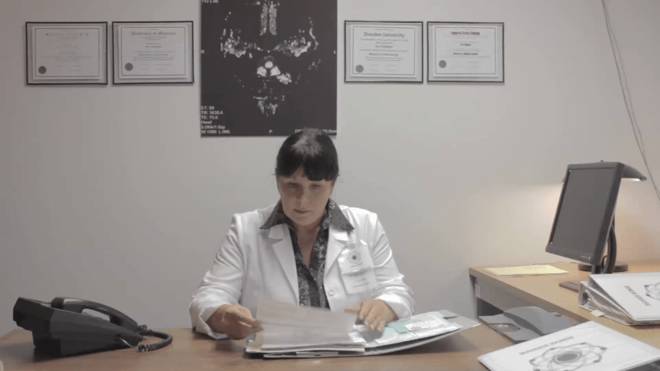 Dr. Eve Pullman (Carlyne Fournier) in her office.