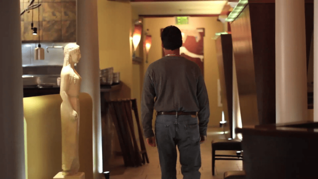 A dejected Henri in his near empty restaurant. 