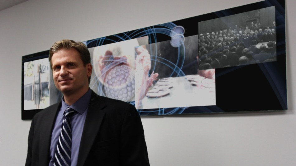 Reincar Scientific's chief legal counsel watches the trial on TV.