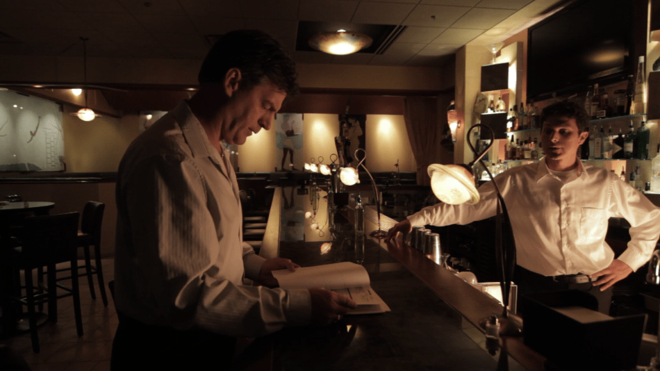 Henri Miller (Vernon Aldershoff) talks with his manager Brian Kovski (Jesse Mangan).