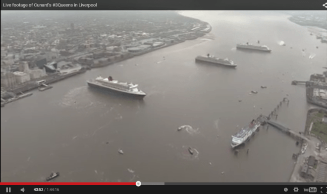 The Queen Mary 2 (left) can be seen in front of the Cunard Building, with Queen Victoria (c) and Queen Elizabeth (r).